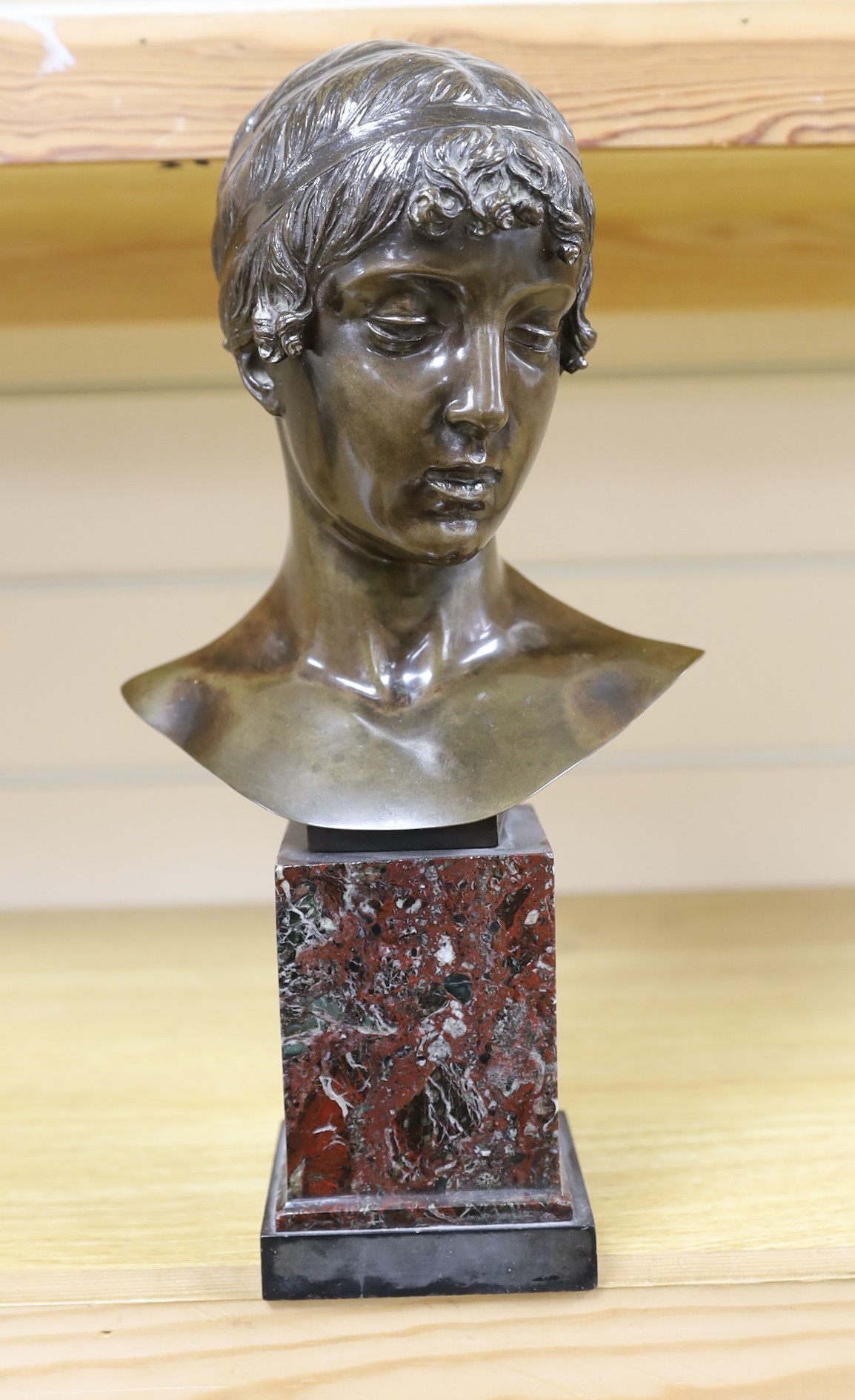 A small, signed Italian bronze bust, after the antique, signed 35cms high